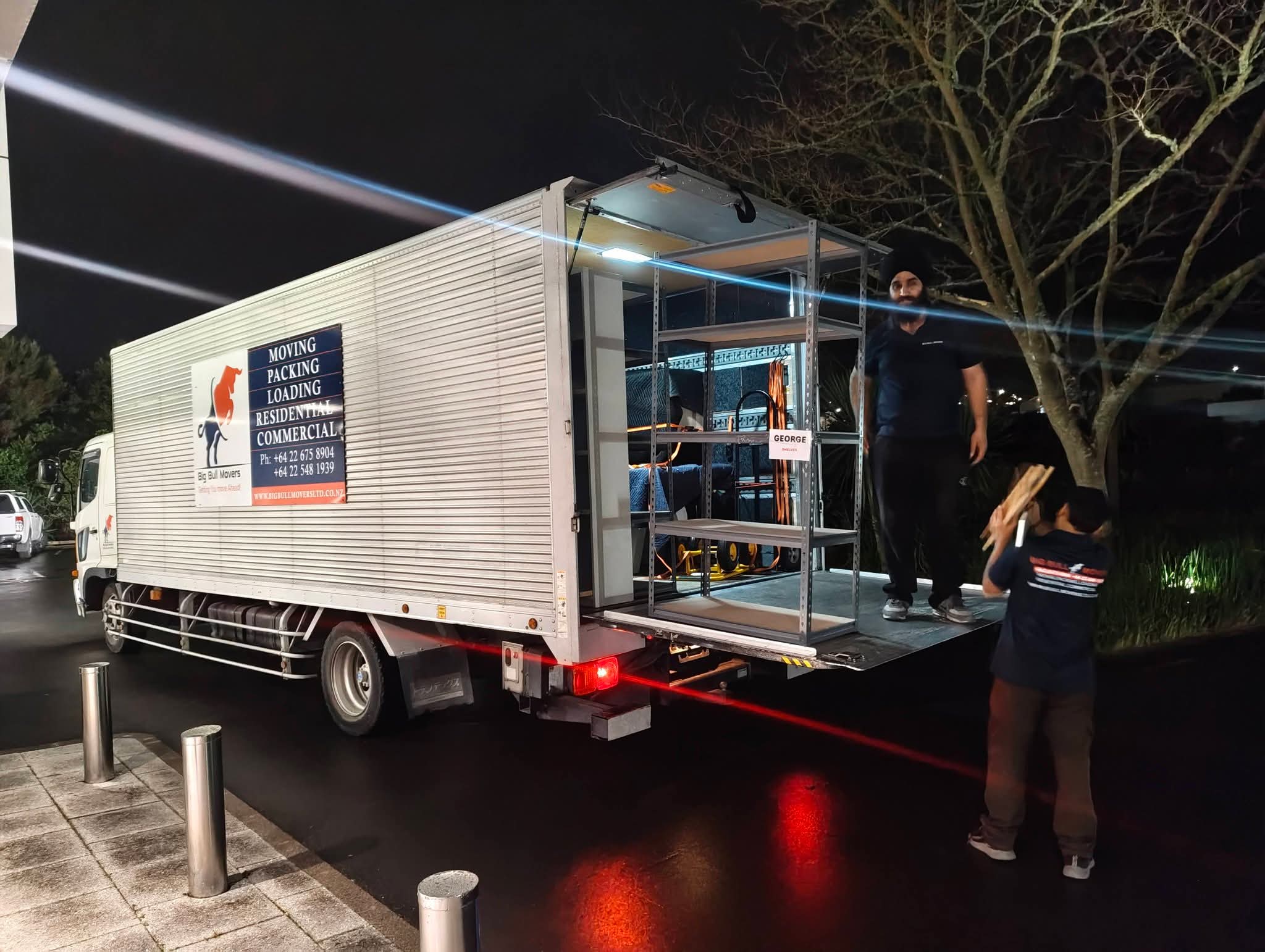 Big Bull Movers team loading office equipment for an after-hours move